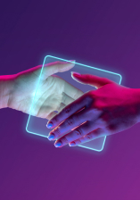 handshake between two persons with a glowing tech cube