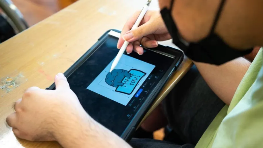 Using a stylus and tablet for the first time, participant brings her vivid imagination to life through digital illustration.