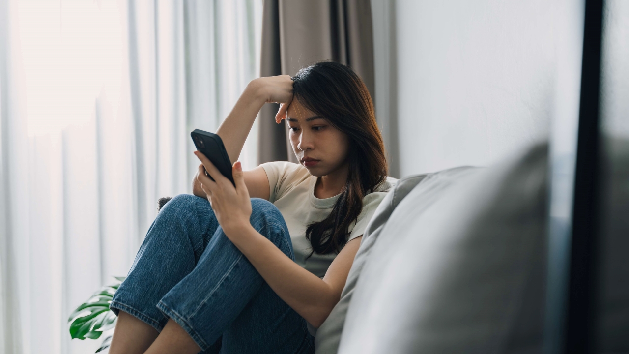 A girl stressing over her phone