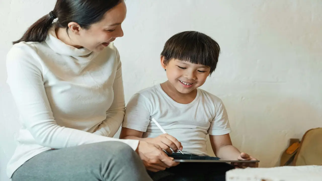Mother and child using a tablet together
