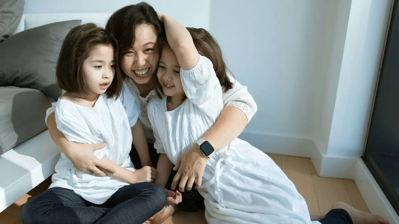 A mum and her two children gather for a happy shot