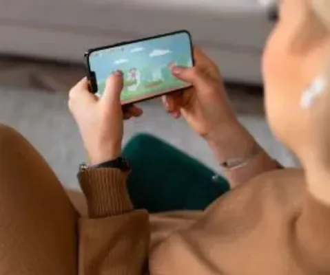 high-angle-view-of-a-woman-playing-with-her-phone